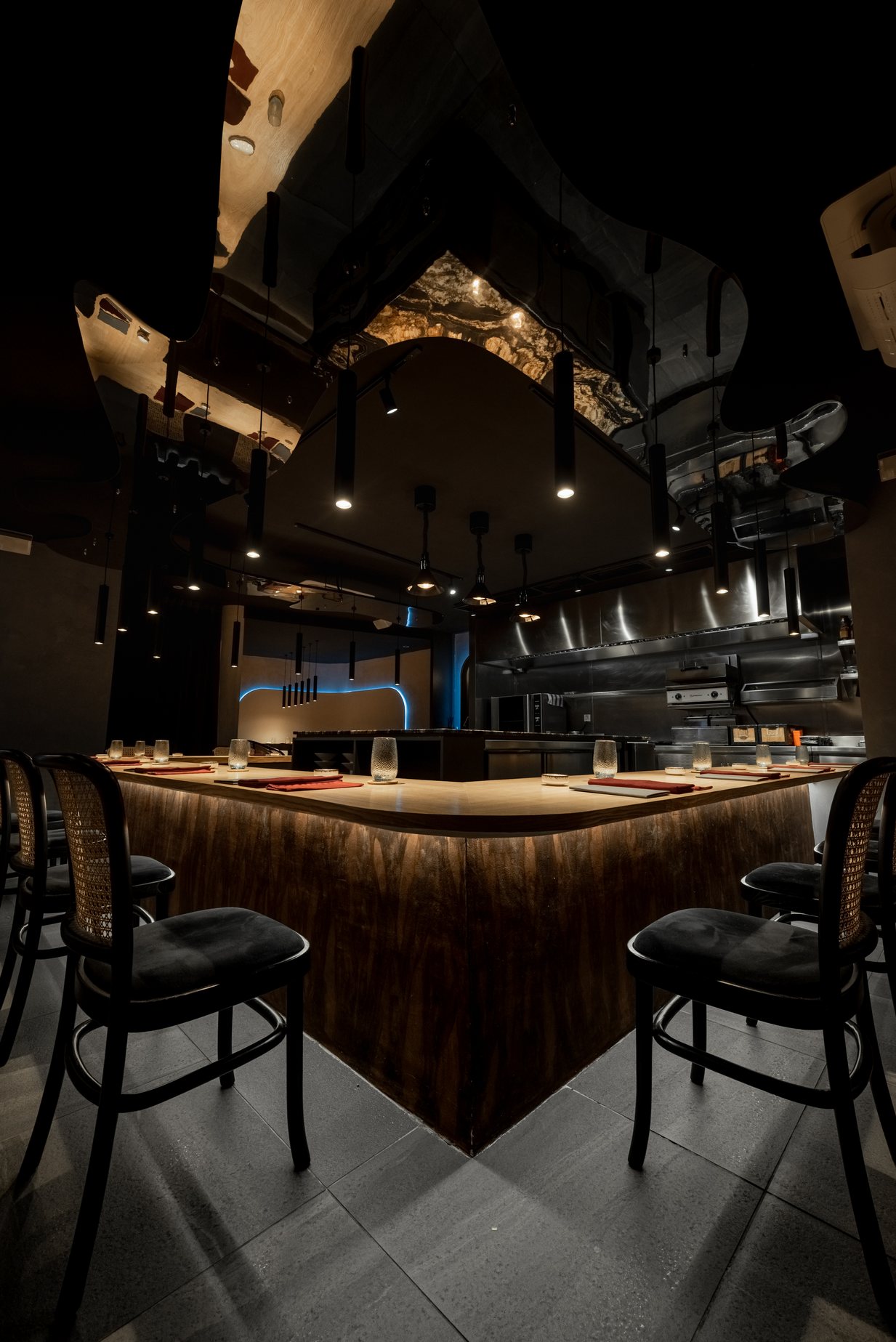 Eat and Cook dining counter beneath a sculptural mirrored ceiling